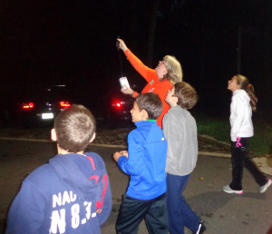 Naturalist Tammy leads a bat walk. Three naturalists, armed with three bat detectors, let the crowd eavesdrop on bats