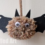 A photo of a pom pom bat craft from Red Ted Art