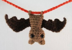 A photograph of a little crocheted bat decoration. 